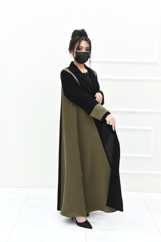 Abaya made from black fauxker fabric and olive taffeta, featuring a stylish rever collar