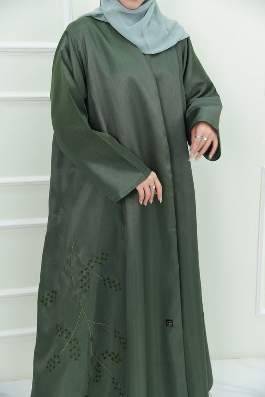 An elegant olive green abaya designed with an exquisite embroidery along the lower hem