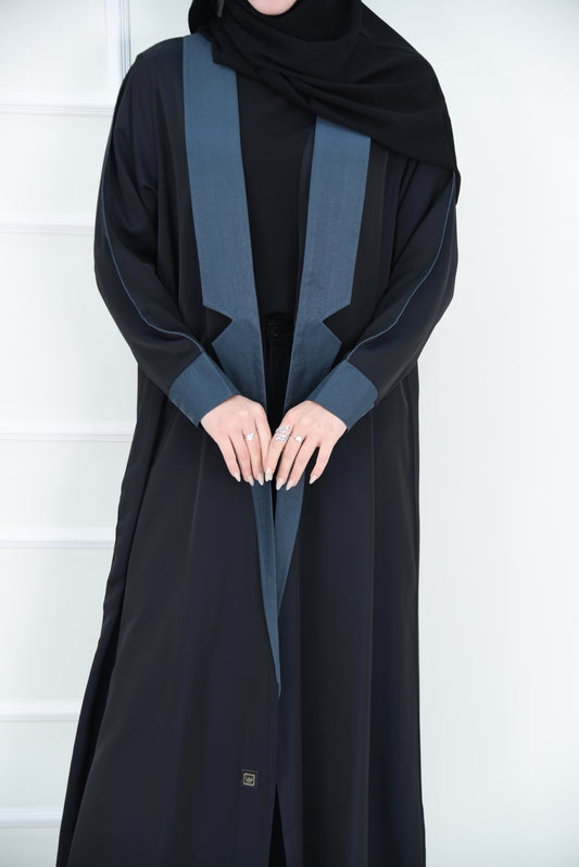 A luxurious satin abaya with blue detailing