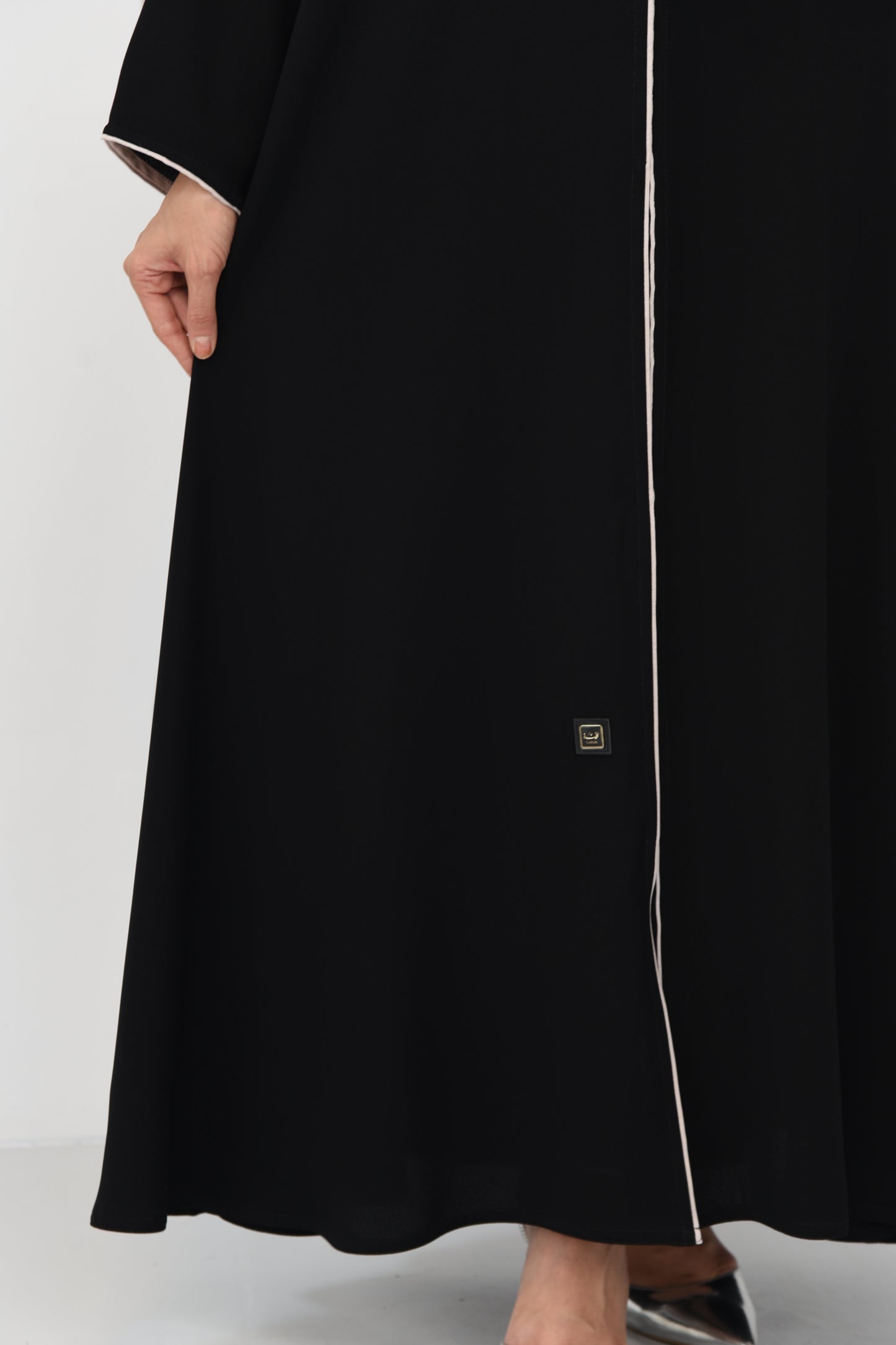 Flared abaya with elegant braided cord detailing
