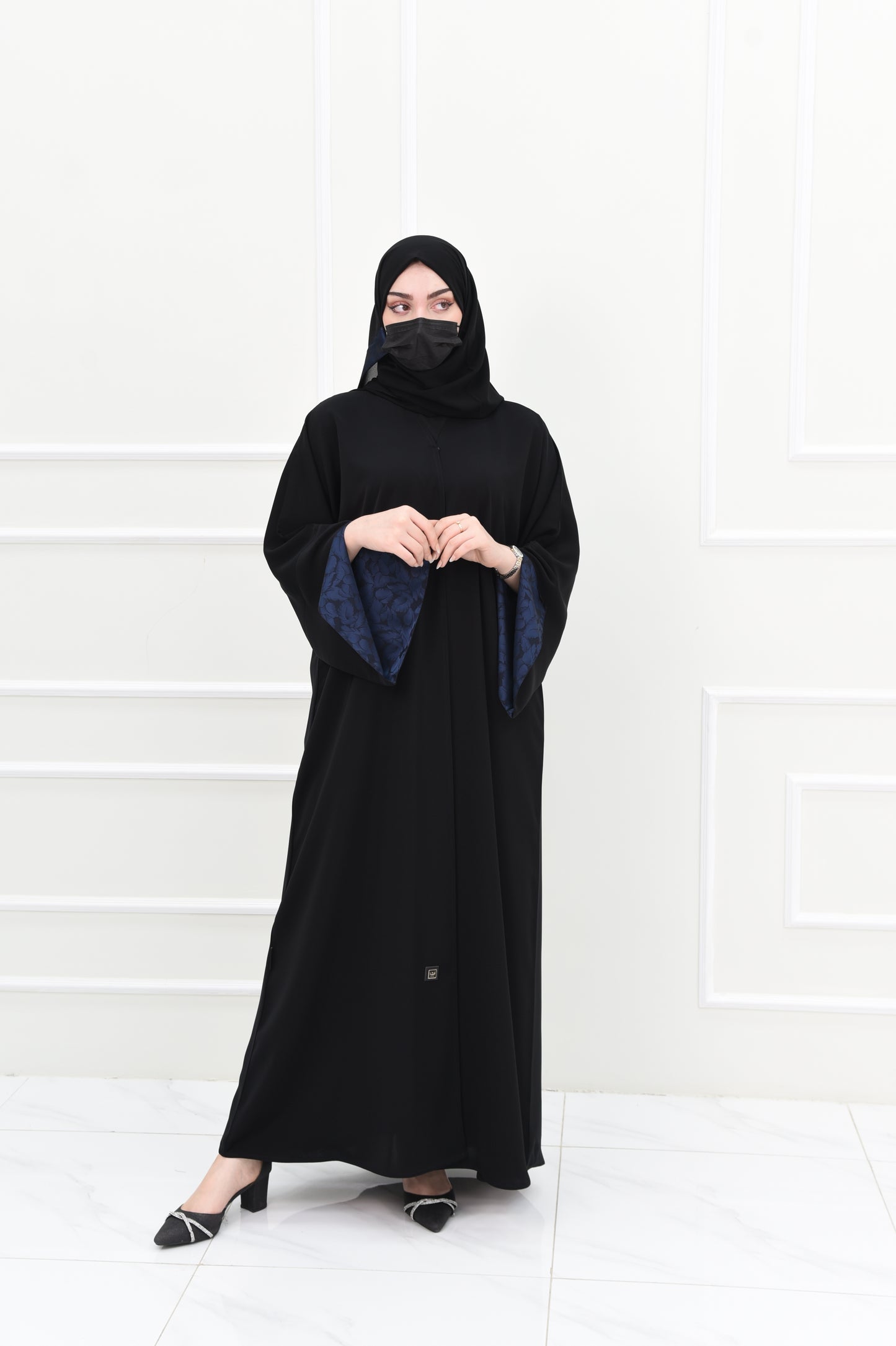 Black abaya with open sleeves lined with navy jacquard fabric