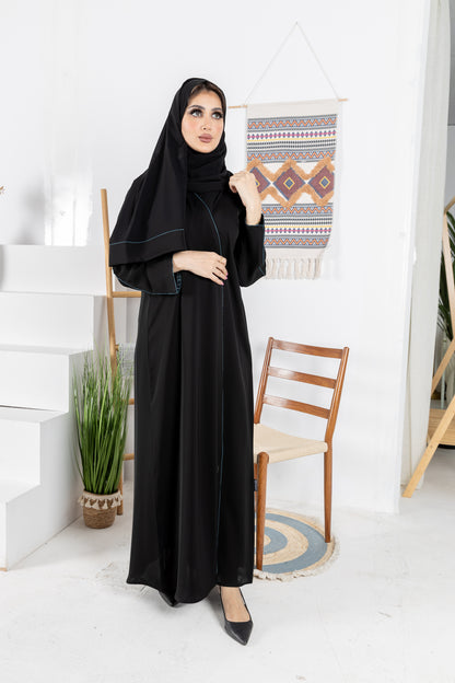 Black abaya trimmed with elegant turquoise lining