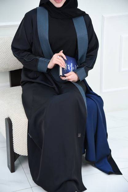 A luxurious satin abaya with blue detailing