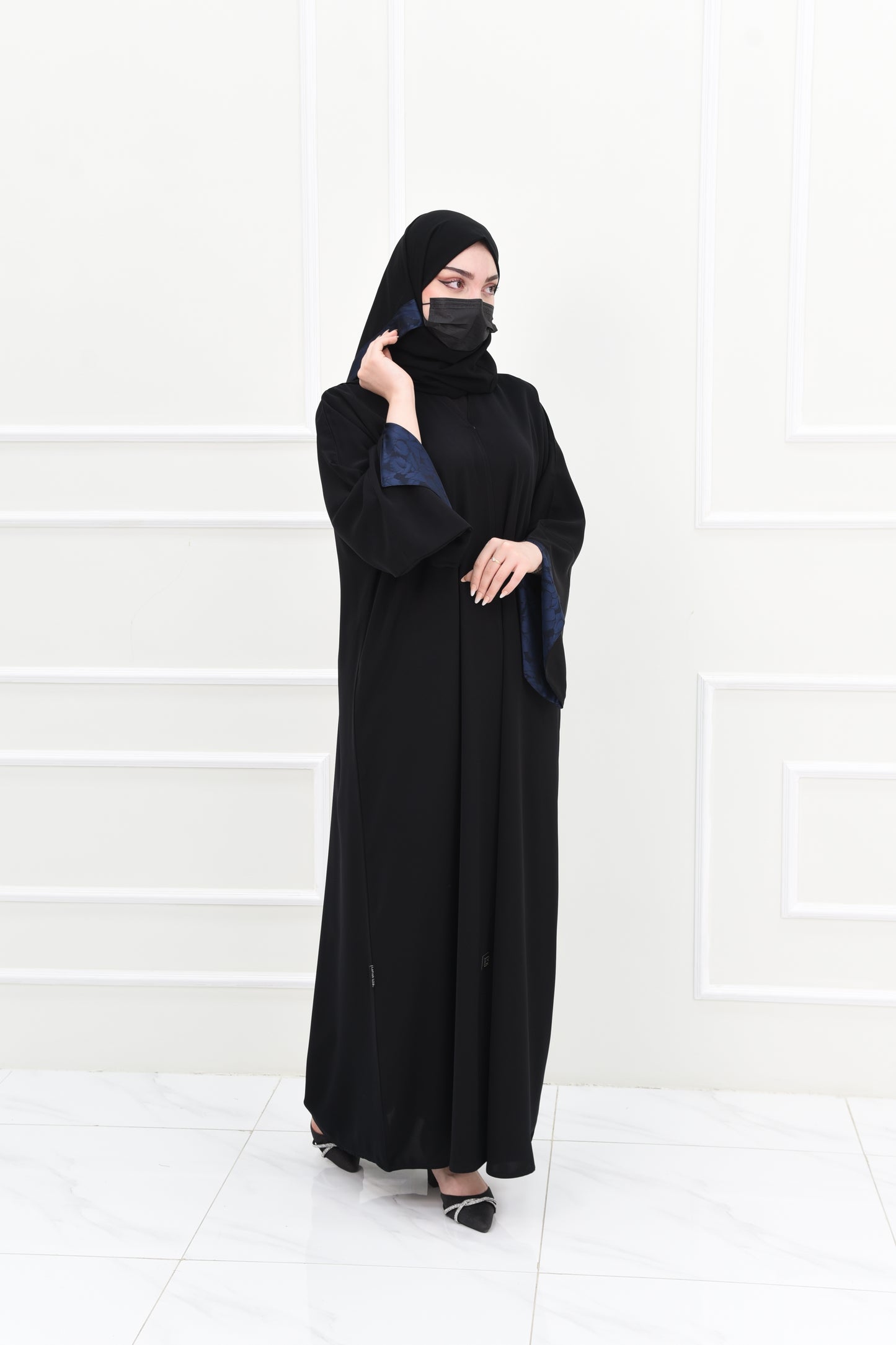 Black abaya with open sleeves lined with navy jacquard fabric