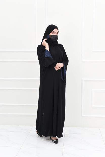 Black abaya with open sleeves lined with navy jacquard fabric