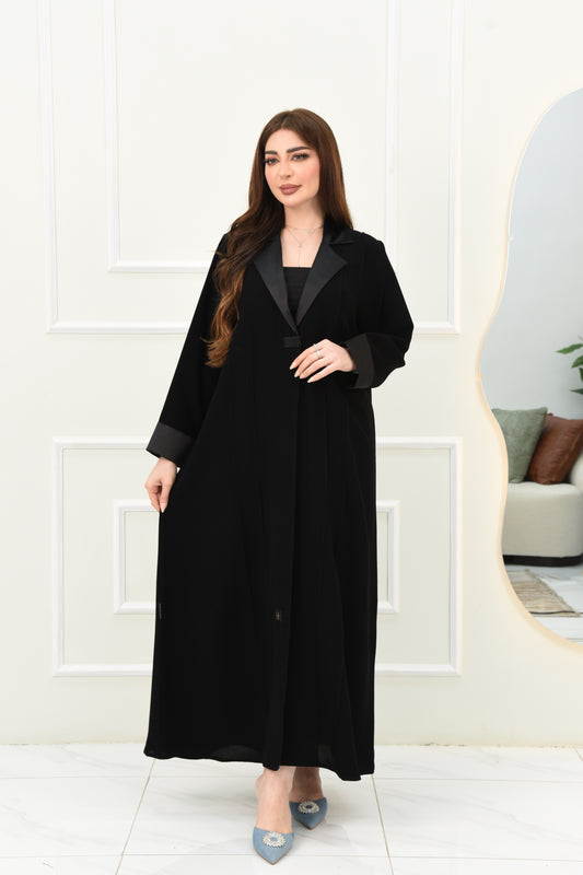 An elegant abaya with a rever collar and satin sleeves