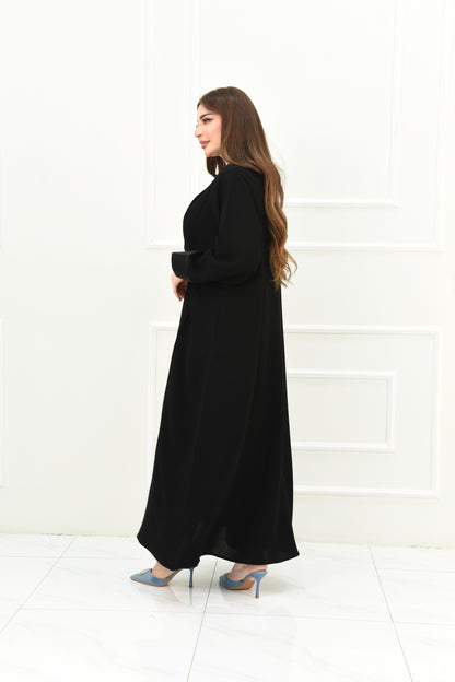 An elegant abaya with a rever collar and satin sleeves