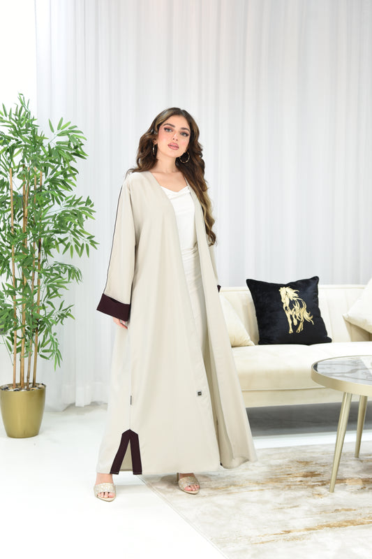 Cream-colored abaya with maroon details