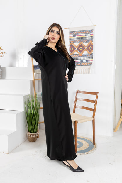 Black abaya trimmed with elegant turquoise lining