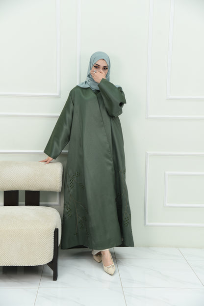 An elegant olive green abaya designed with an exquisite embroidery along the lower hem