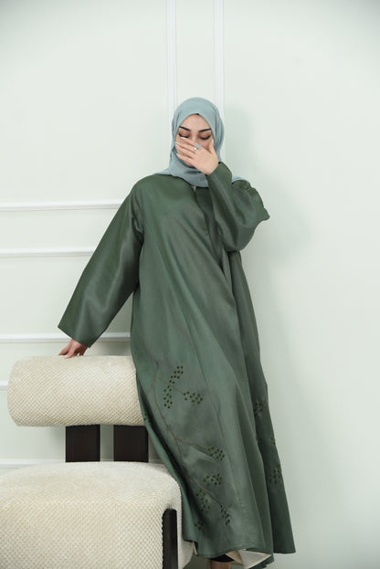 An elegant olive green abaya designed with an exquisite embroidery along the lower hem