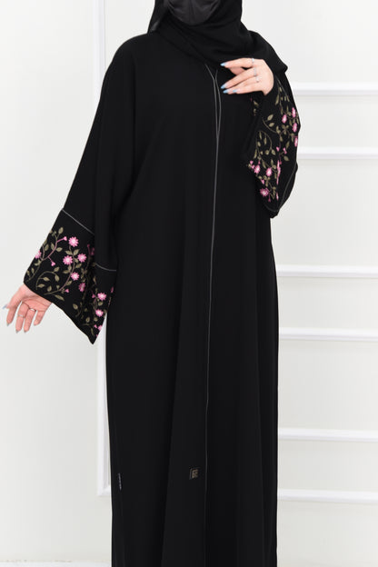 Black abaya adorned with delicate pink embroidery and accented with olive green trim