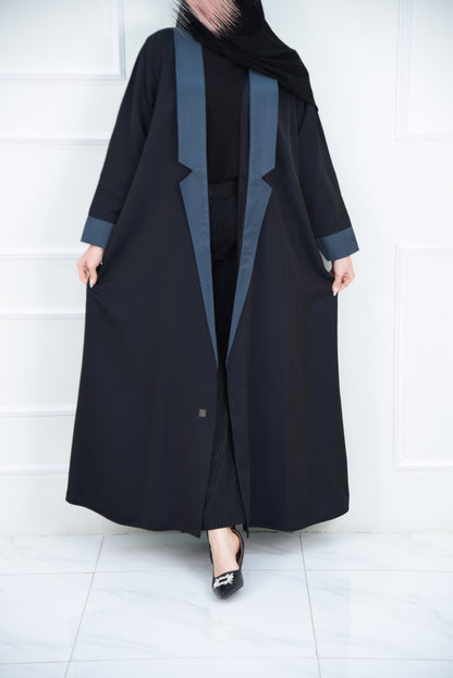 A luxurious satin abaya with blue detailing